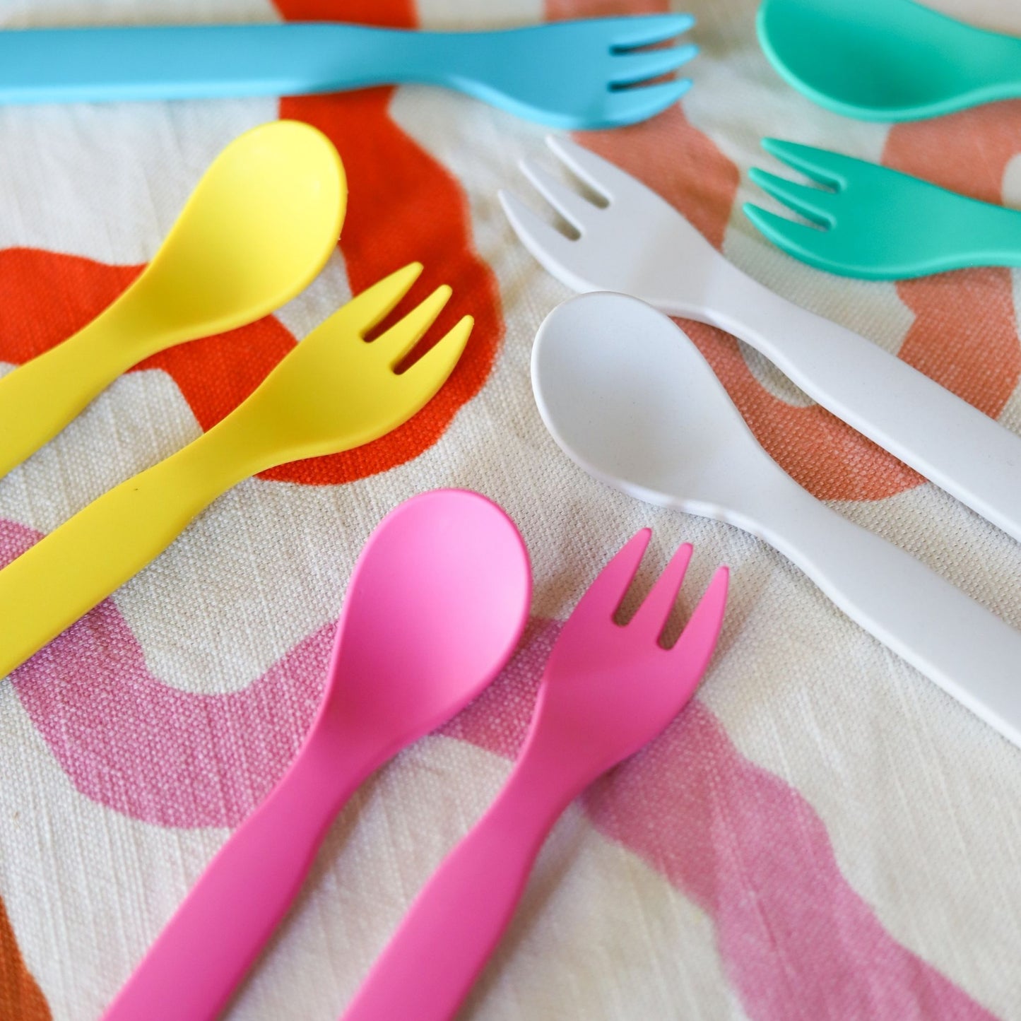 Bobo&boo fork & spoons in pink, green, blue, grey & green on a cute tablecloth
