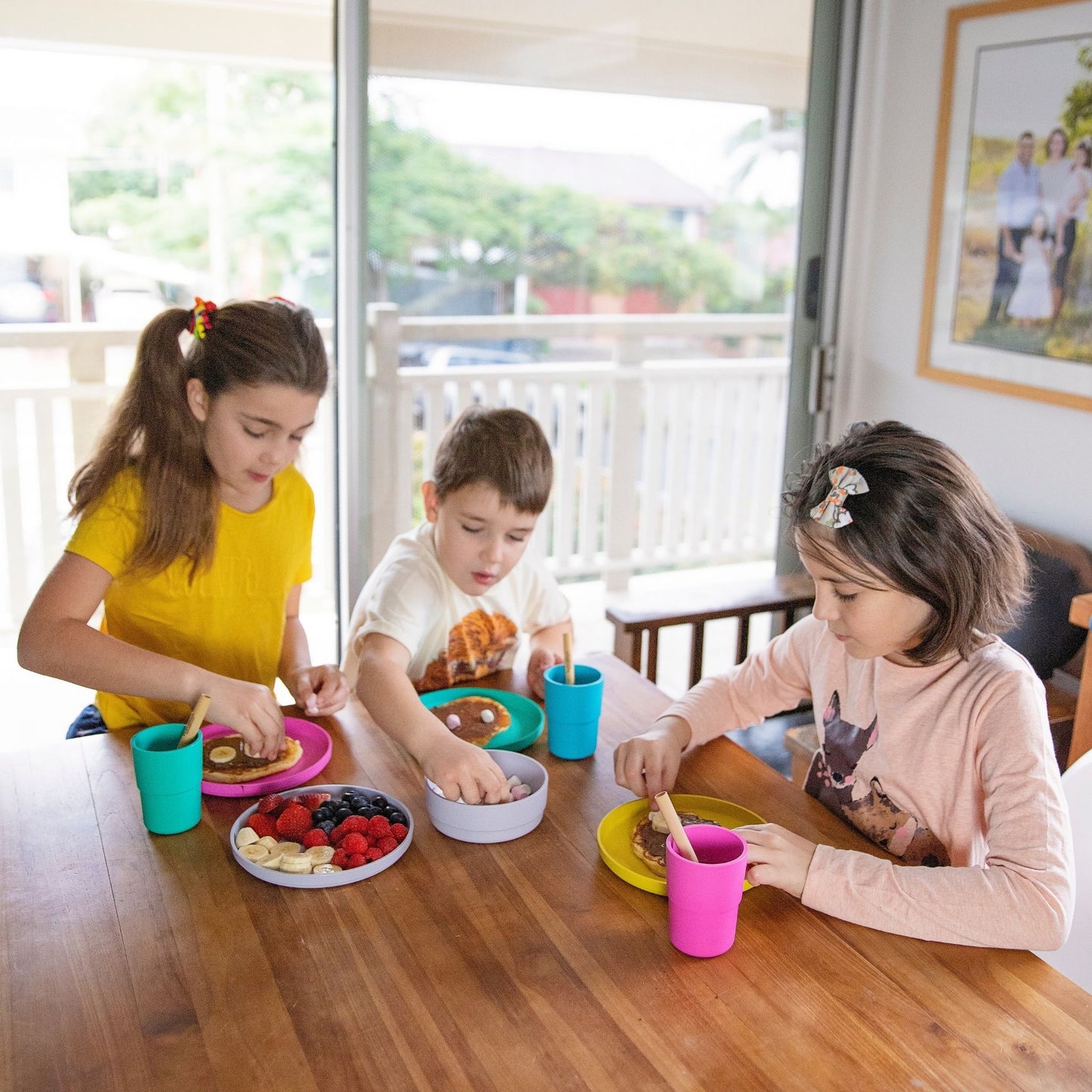Kids are eating the food in bamboo bowl