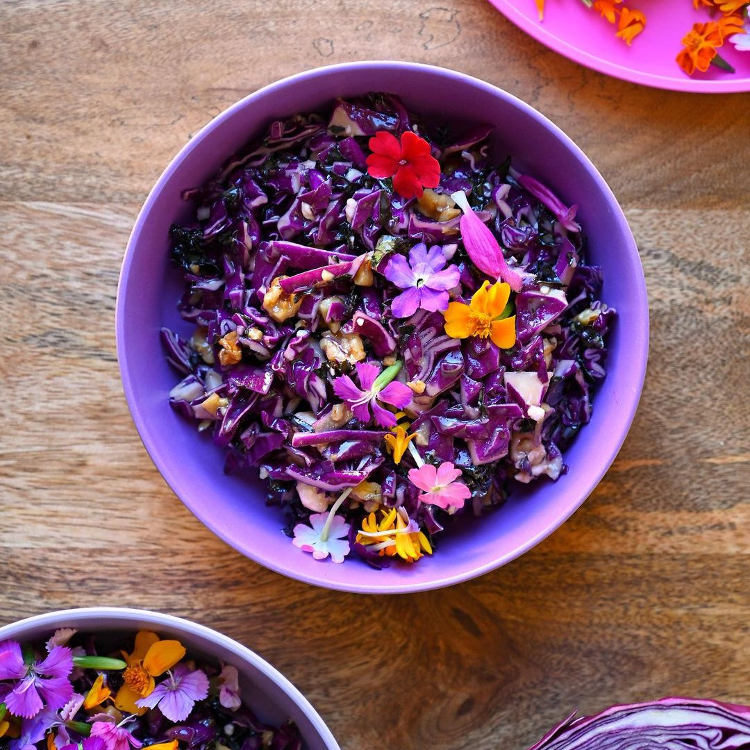 edible flowers in a bamboo bowl