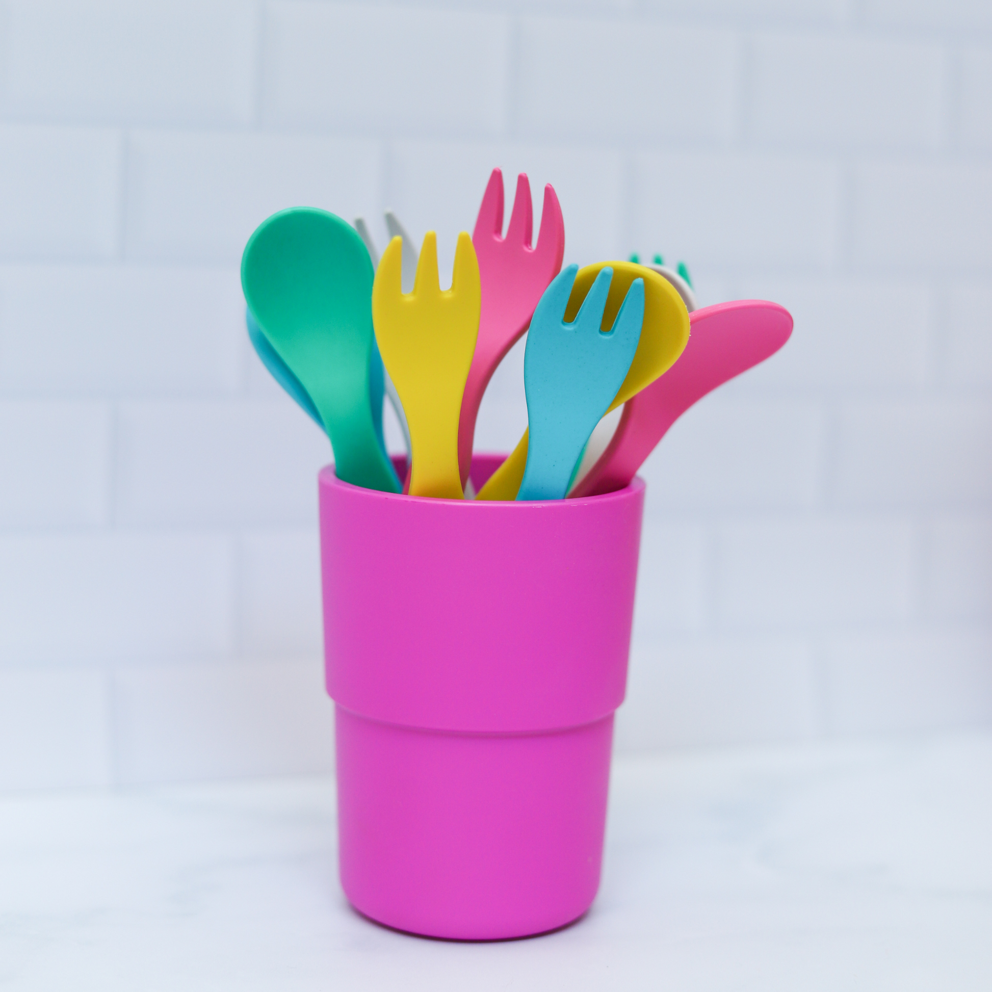 bobo&boo curlery fork & spoon sitting in a pink plant-based cup